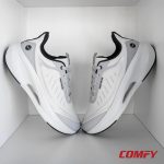 Pair of Red Tape white and grey athleisure sports shoes for men displayed in a modern white box.