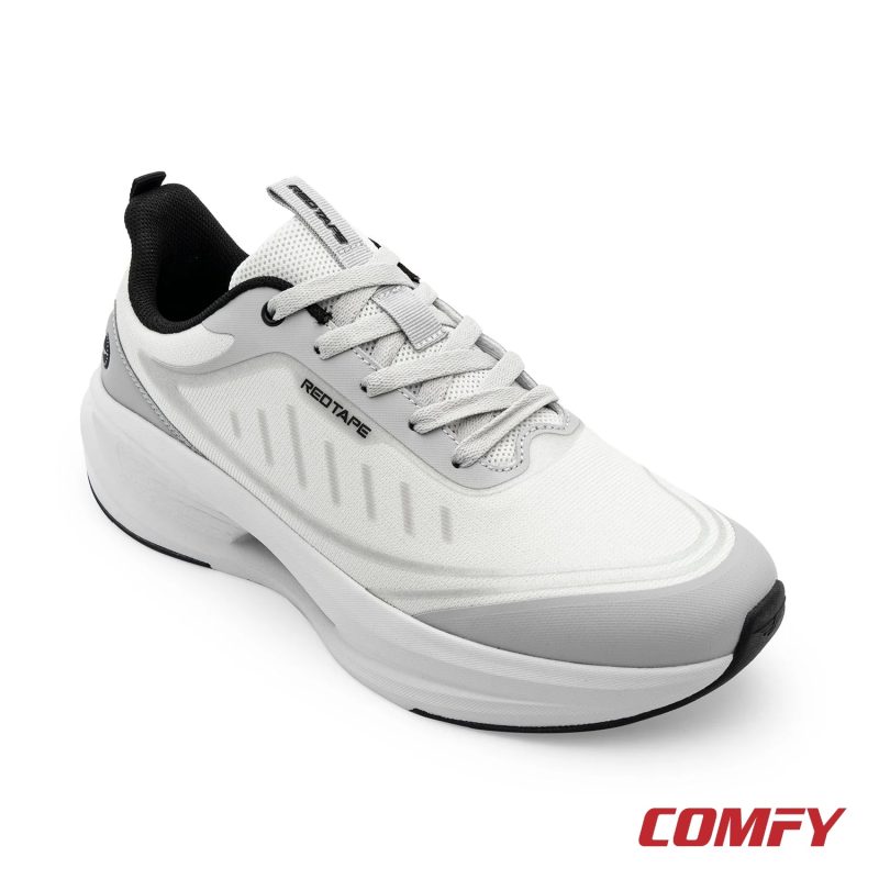 Angled view of Red Tape white and grey athleisure sports shoe for men, showcasing modern design and comfortable sole.