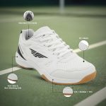 White Redtape men's badminton shoes on court with callouts: moulded EVA insole, PU mesh, anti-skid non-marking sole, EVA+rubber+TPU.
