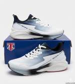 White and navy RedTape lifestyle sports keds for men displayed on a blue box, showcasing their sleek design and comfortable build.