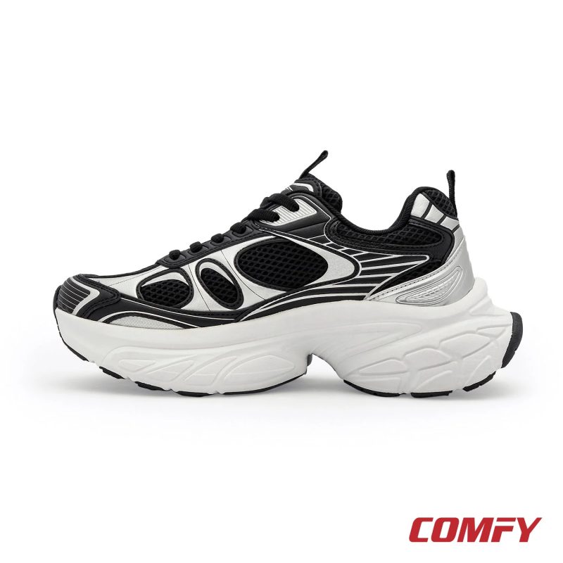 Left side profile of a Red Tape black and silver chunky casual shoe for women, highlighting its thick white sole.