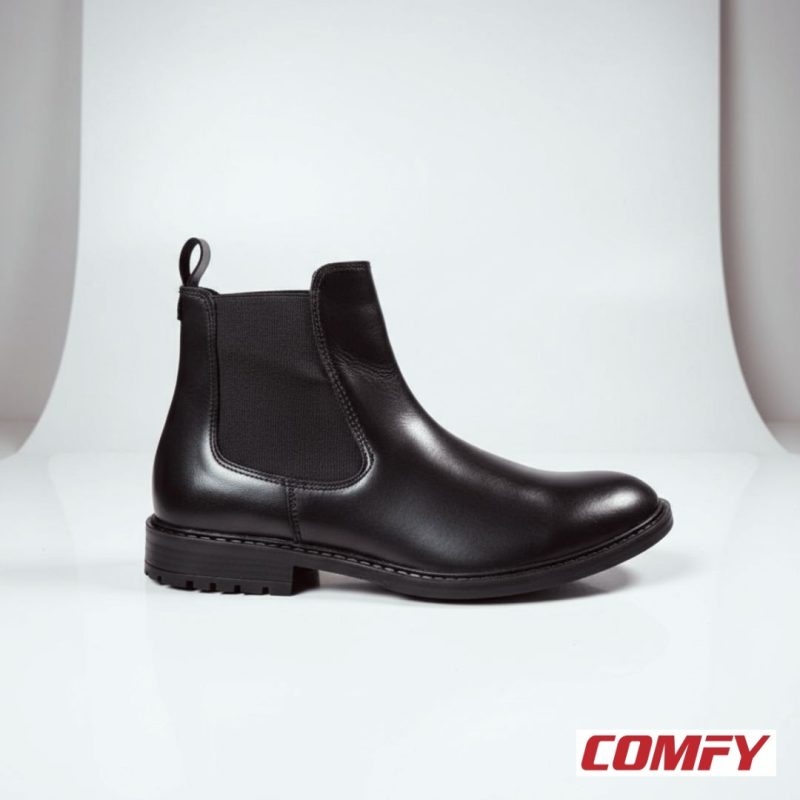 Side view of a men's black leather Chelsea boot on a white background, showing elastic panel and sturdy sole.