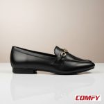 Side profile of a sleek black chain loafer for women on a reflective surface, highlighting its elegant design and silver chain detail.