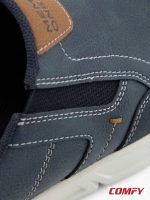Close-up of Memphis One navy half-shoe, showing detailed white stitching, textured material, brown brand tag, and elastic goring for fit.