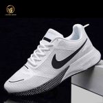 Single AeroFlex white running shoe with black swoosh on a grey block, highlighting lightweight design and textured sole.