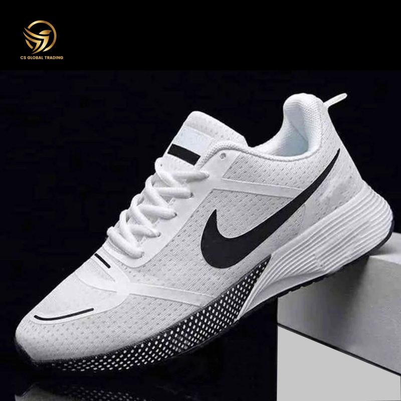 Single AeroFlex white running shoe with black swoosh on a grey block, highlighting lightweight design and textured sole.
