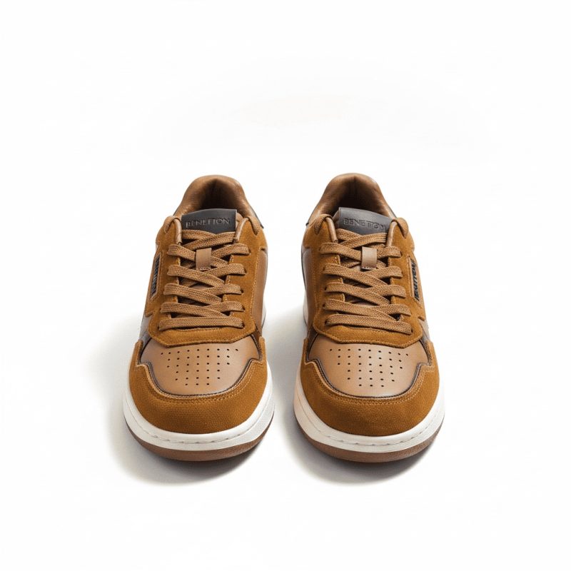 Direct front view of Benetton men's brown lifestyle sneakers, highlighting the laces and perforated toe box.