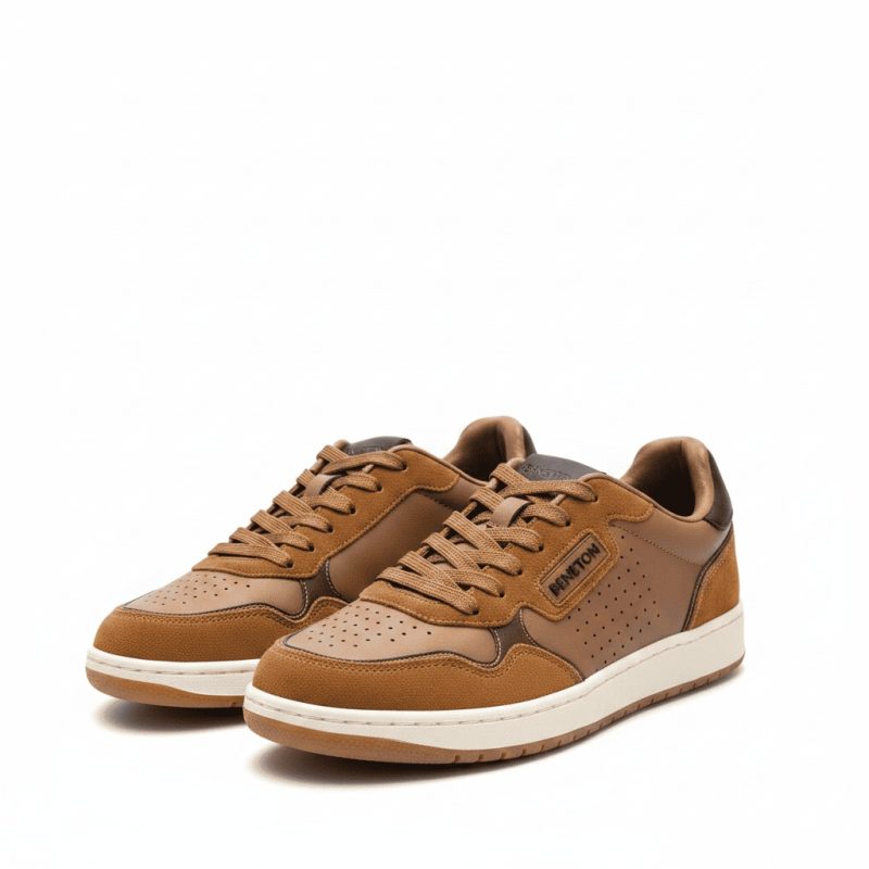 Front-right angled view of Benetton men's brown lifestyle sneakers with tan suede and white soles, on a white background.