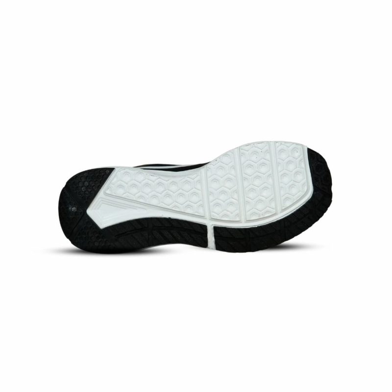 Underside view of Shadow Zoom black running shoe sole with white hexagonal grip pattern and durable black rubber, for optimal traction.