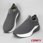 A pair of grey ETPU walking slip-on shoes on a neutral light grey background.