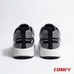 Rear view of grey Nike Zoom men's sports shoes, highlighting white midsole and 'NIKE' branding on black heel.