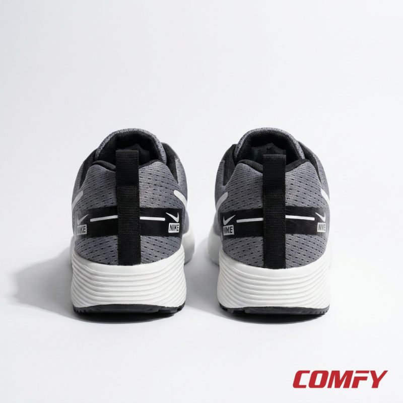 Rear view of grey Nike Zoom men's sports shoes, highlighting white midsole and 'NIKE' branding on black heel.