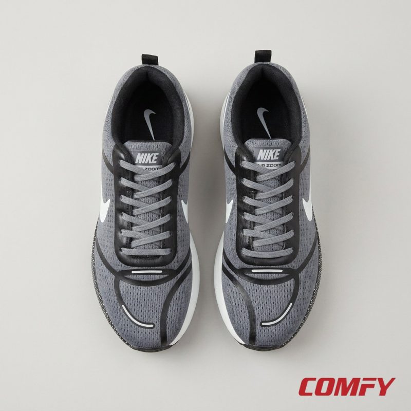 Top-down view of grey Nike Zoom sneakers for men, showcasing mesh upper, black laces, and white Nike swoosh detailing.