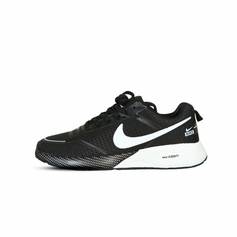 Single black Nike Zoom running shoe, white swoosh, side view on clean white background, demonstrating sleek profile.