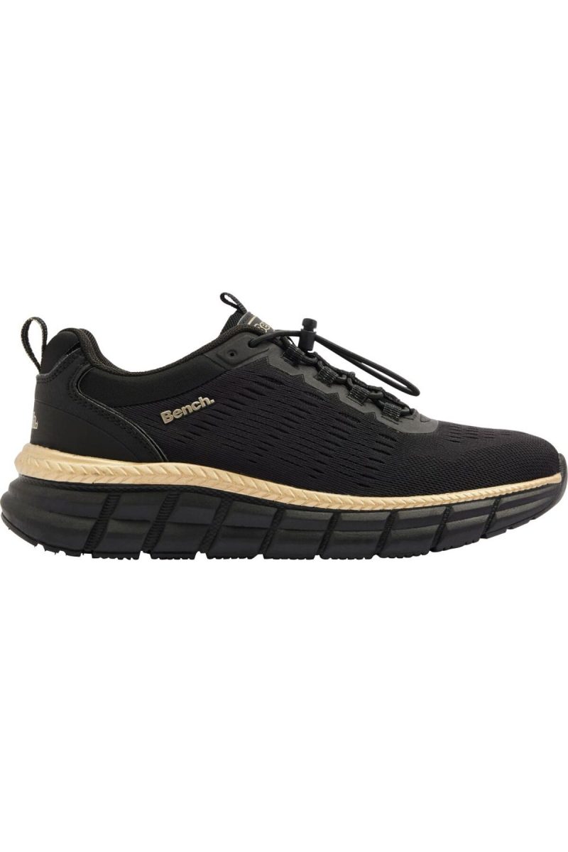 Lateral side profile of Bench black slip-on trainer with gold trim stripe and textured midsole.