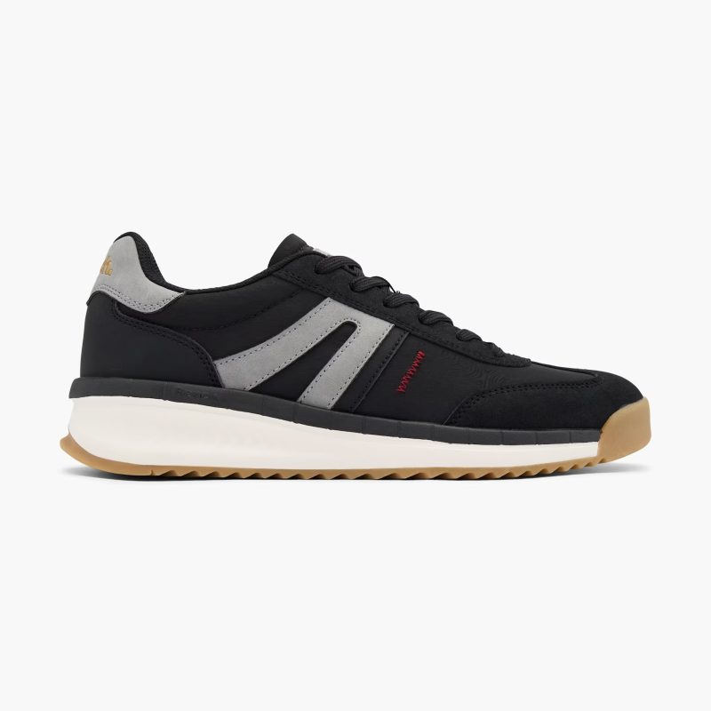 Side view of Bench men's black sneakers with grey accents and a white midsole.