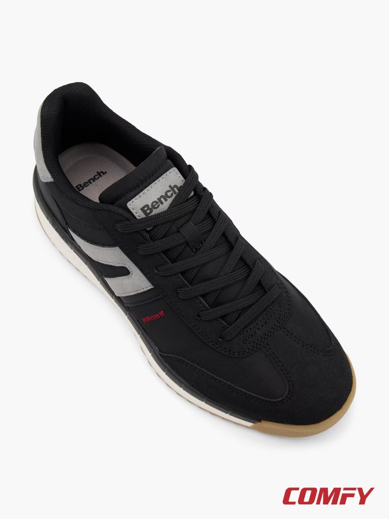 Top view of Bench men's black lace-up sneakers highlighting laces and tongue logo.