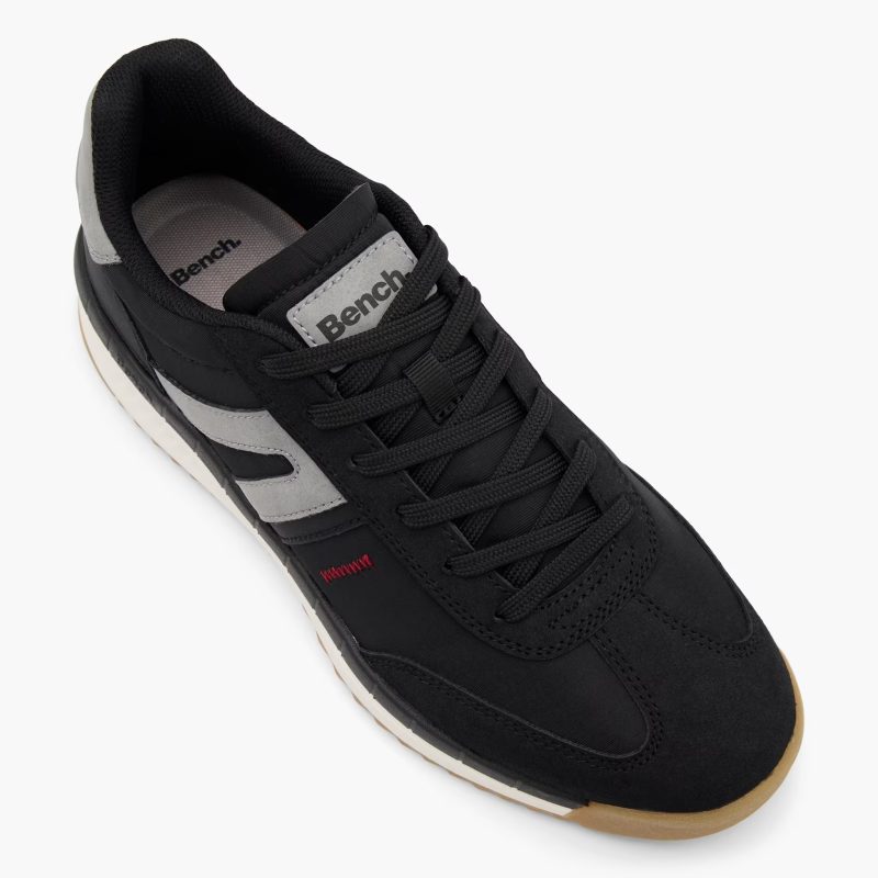 Top view of Bench men's black lace-up sneakers highlighting laces and tongue logo.
