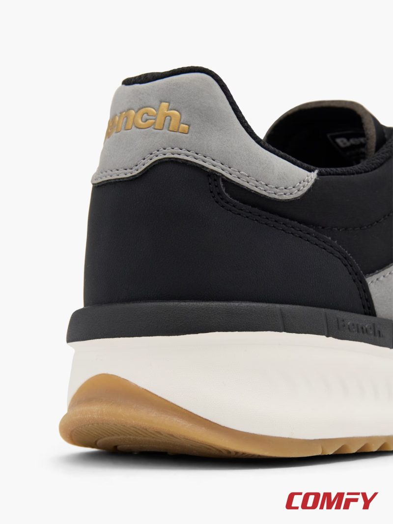 Close-up of the gold Bench brand logo on the grey heel tab.