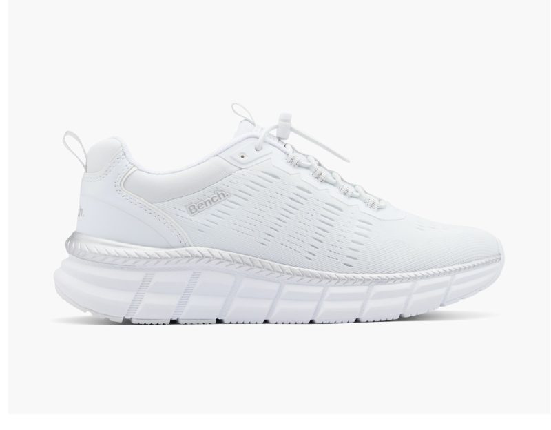 Side view of Bench White Slip-On Trainer featuring white mesh upper and thick white sole with silver accent.