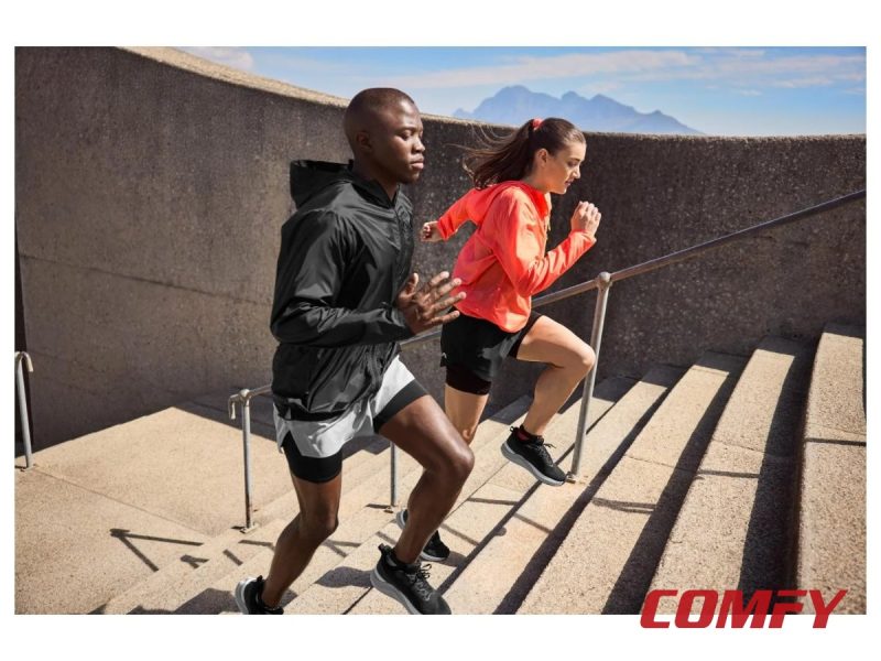 Athletic couple wearing Crivit running shoes while exercising outdoors.