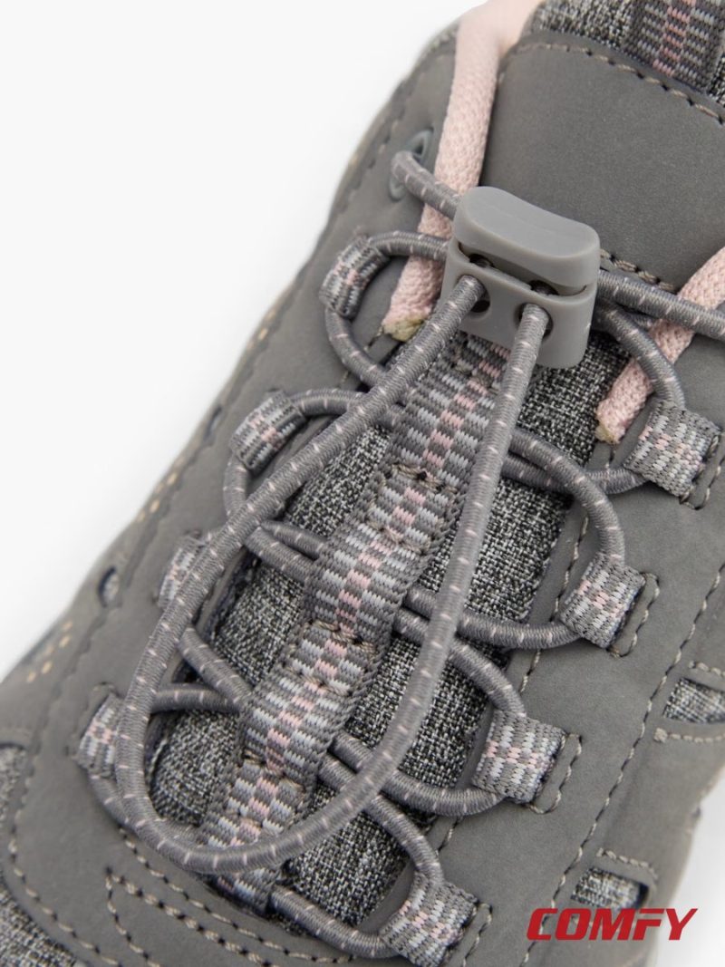 Detailed close-up of quick-release toggle laces on grey walking shoes.