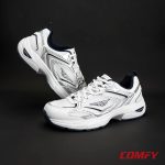 Red Tape casual shoes displayed on a sleek dark grey background showing off the design.