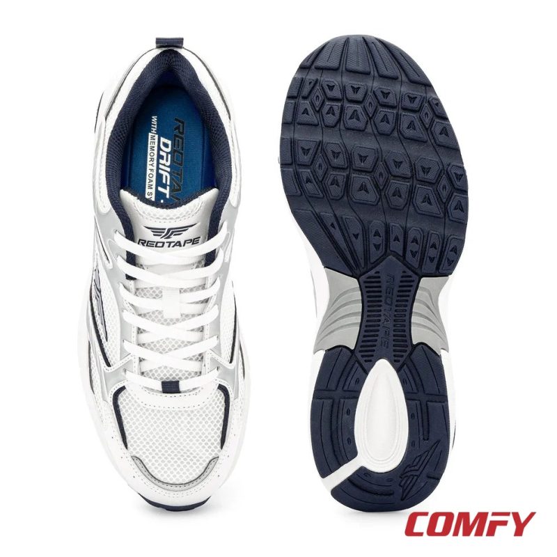 Overhead view of Red Tape Drift+ memory foam insole and navy rubber outsole grip pattern.