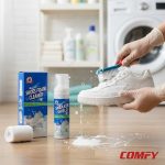 Scrubbing white sneakers with a brush and rich lather using Biki Shoes Foam Cleaner.