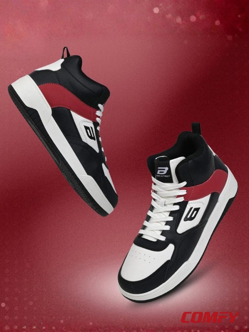 Pair of Red Tape Bond Street sneakers floating over a textured red background.