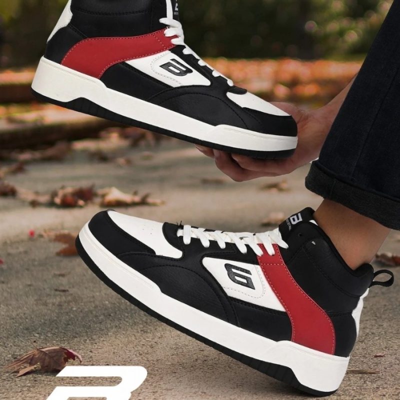 Outdoor lifestyle shot of Bond Street by Red Tape sneakers on pavement.