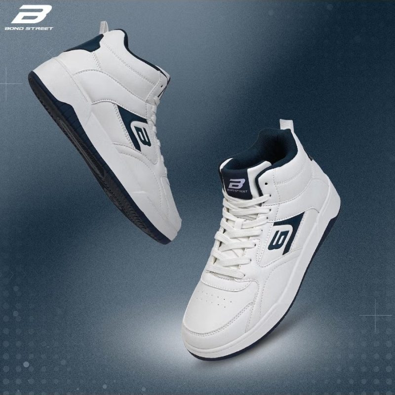 Floating pair of white and navy Bond Street sneakers.