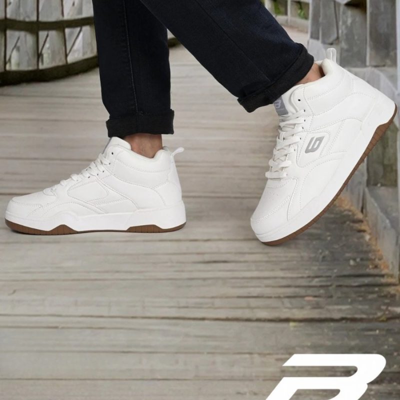 On-foot look of white Bond Street sneakers on a wooden path.