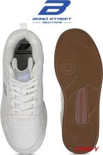 Top view of white Bond Street sneaker next to its textured tan rubber sole.