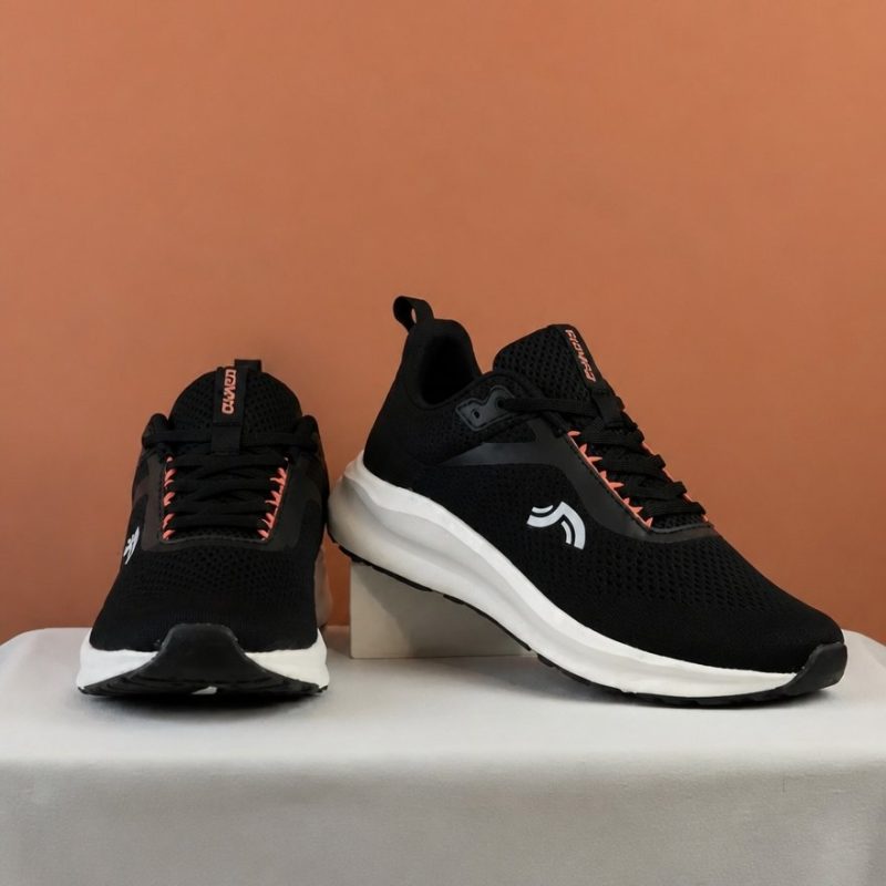 Front view of CRIVIT women's running shoes in black with white cushioned soles.