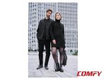 Man wearing Esmara navy blue leisure shoes standing next to a woman in a black turtleneck dress.