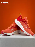 Pair of CRIVIT bright orange and pink women's running trainers.