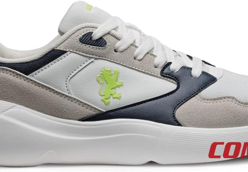 Lateral profile of Red Tape white, beige, and navy colourblocked sneaker.
