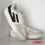 Aesthetic studio shot of a pair of Red Tape lifestyle sneakers leaning in a white corner.