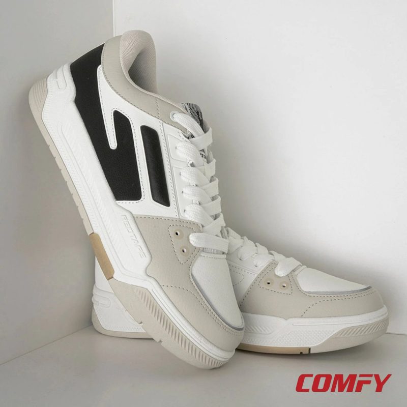 Aesthetic studio shot of a pair of Red Tape lifestyle sneakers leaning in a white corner.