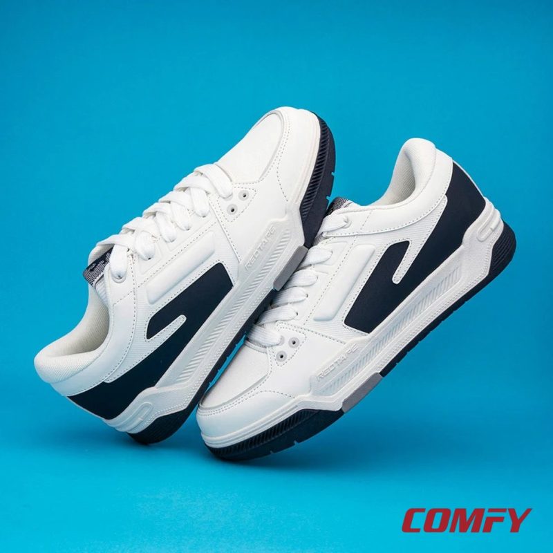 Two Red Tape lifestyle sneakers floating on a blue studio background.