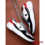 Artistic lifestyle shot of Red Tape white and red sneakers