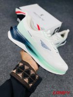 Hand holding Redtape Classic Velocity Pro sneaker